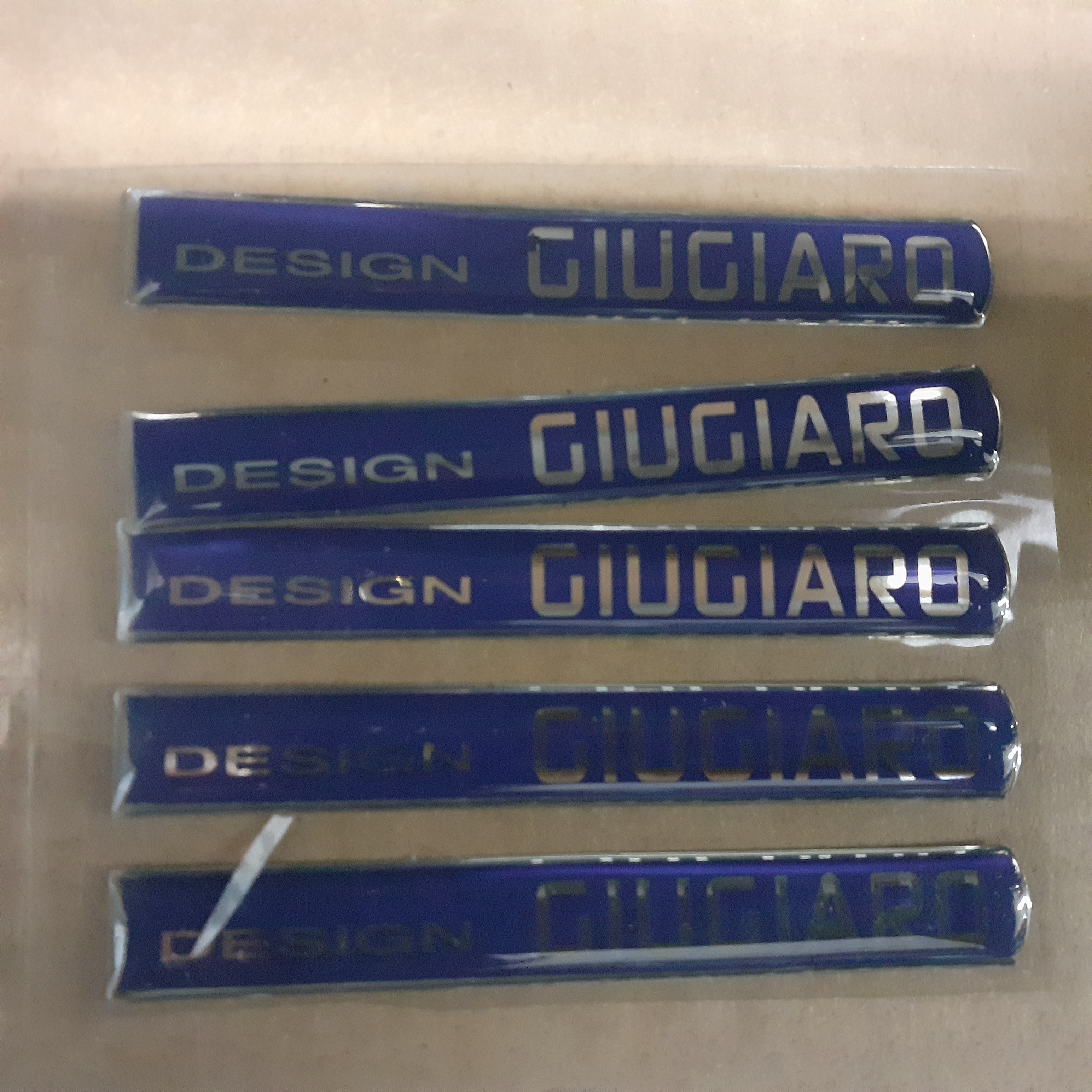 Door Emblem DESIGN GIUGIARO fits Iveco Alfa Romeo Fiat Lancia 3802740 Genuine View Front