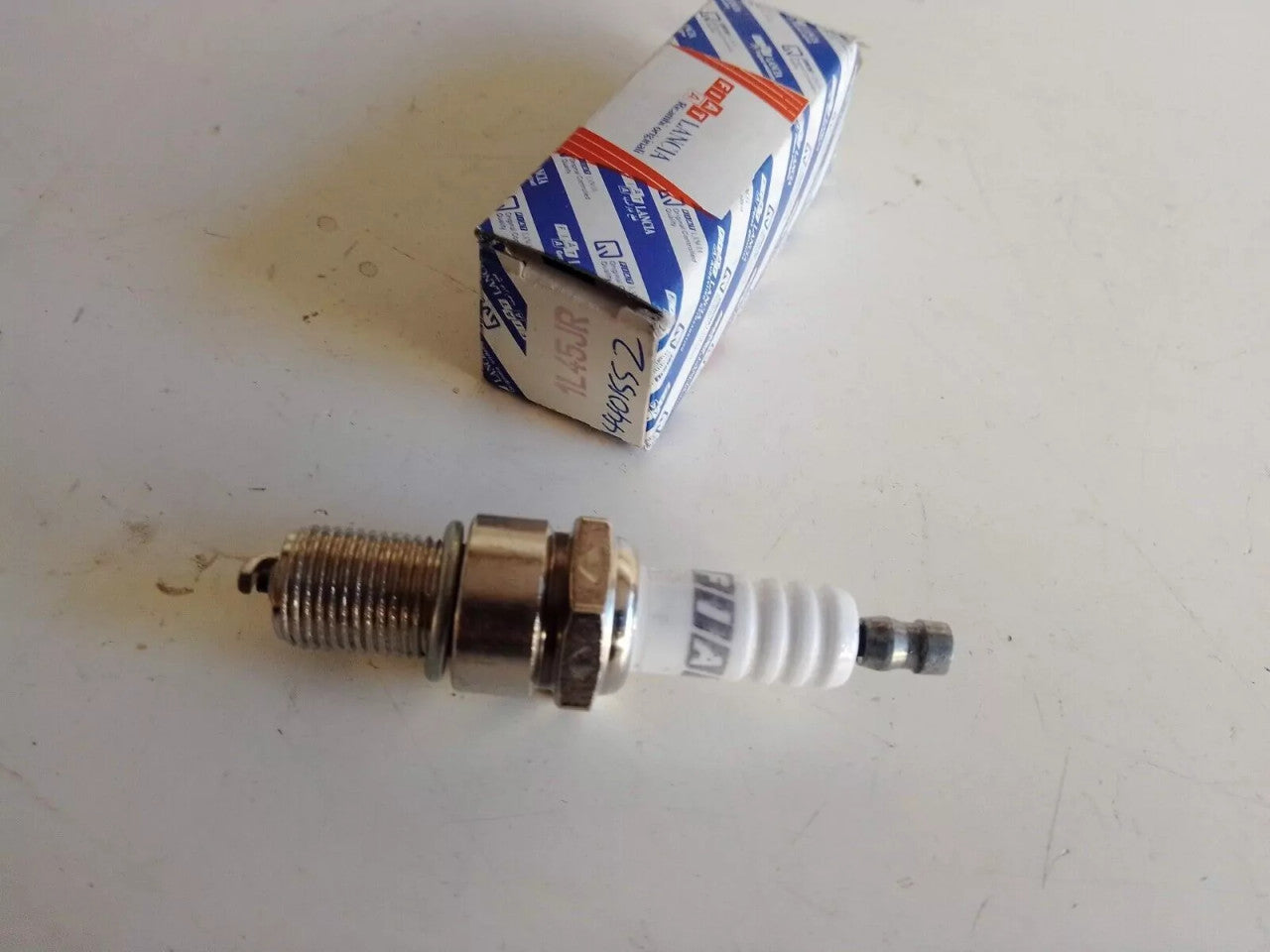 4x Spark Plug fits Fiat Lancia 1L45JR 4401552 Genuine View Front