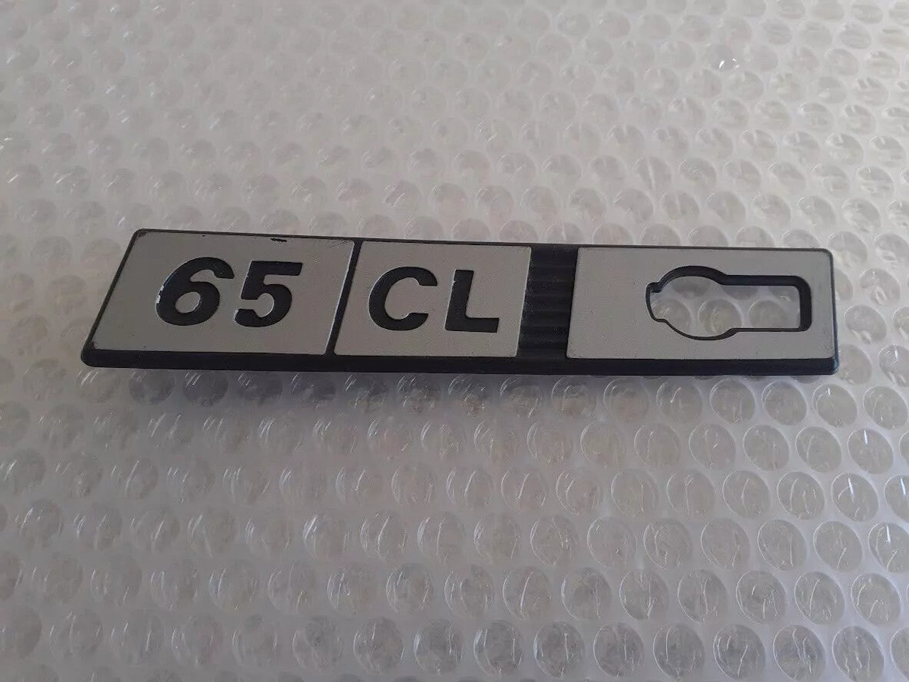 Emblem 65 CL Left Plastic fits Fiat Ritmo Genuine 65CL-Left View Front