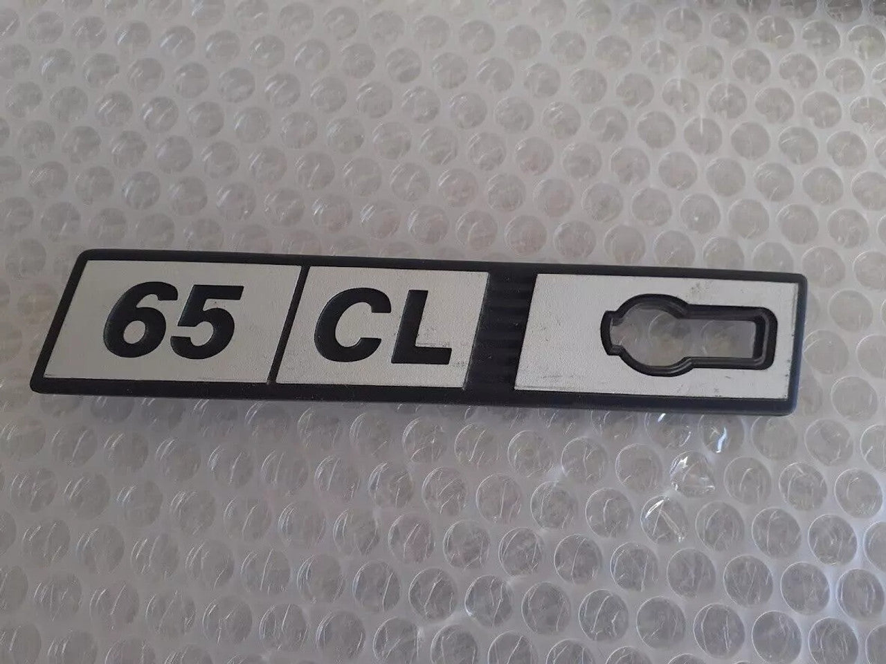 Emblem 65 CL Left Metal fits Fiat Ritmo Genuine 65CL-Metal View Front