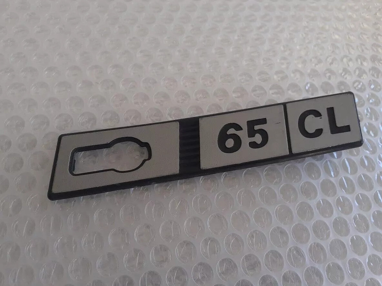 Emblem 65 CL Right Plastic fits Fiat Ritmo Genuine 65CL-Right View Front
