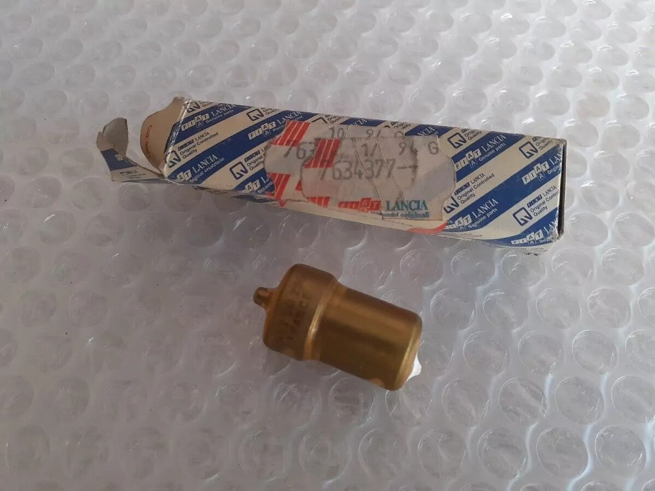 Fuel Injector Nozzle fits Fiat Lancia Alfa Romeo 7634377 DN12SD290 Genuine View Front