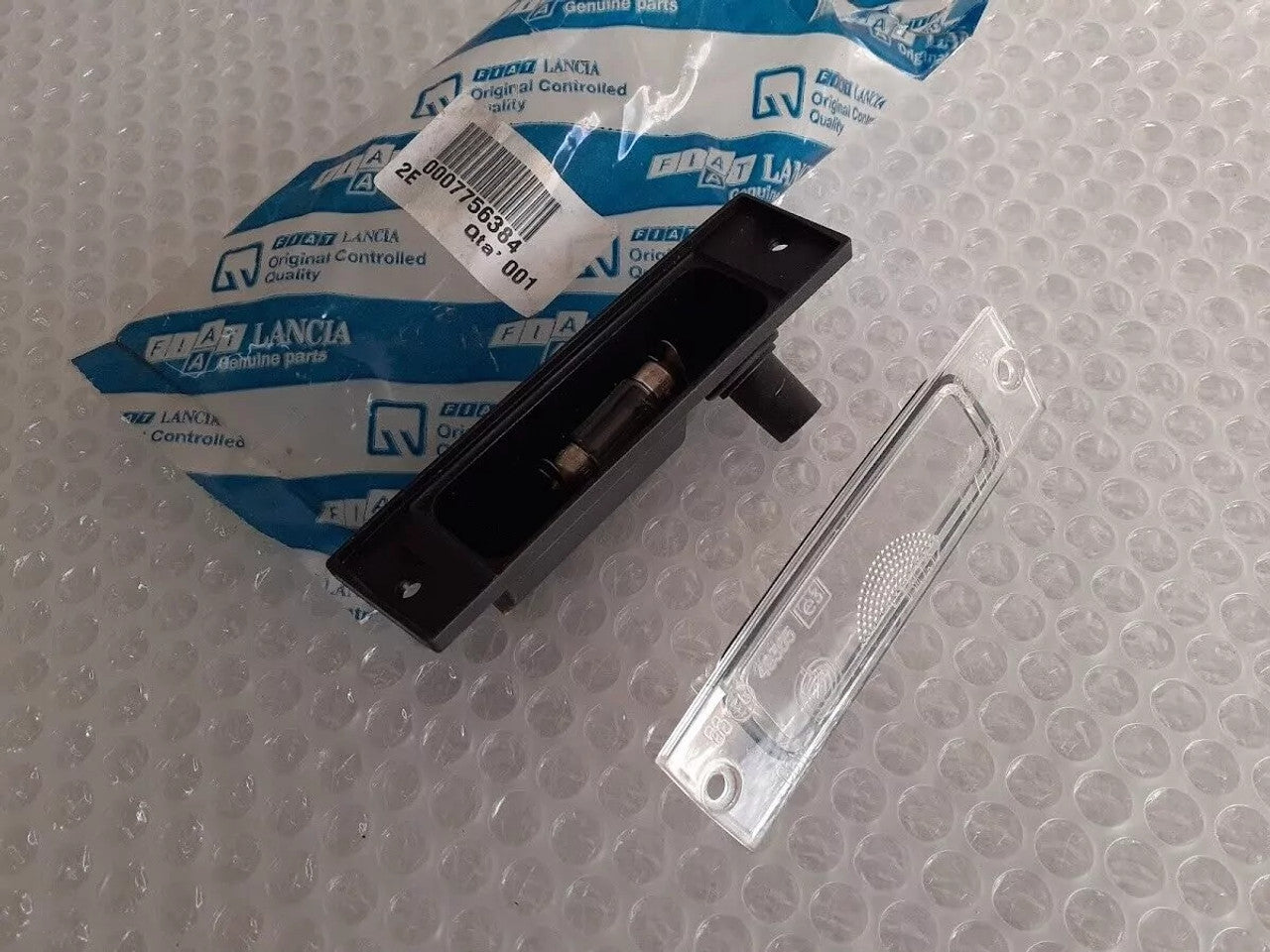 License Plate Light fits Fiat Punto 7756384 Genuine View Front