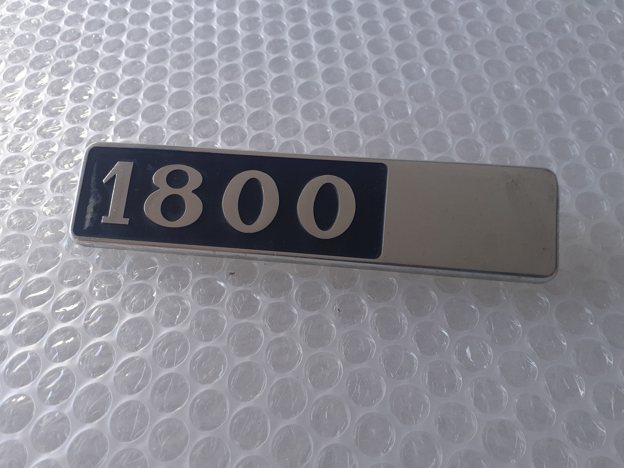Emblem 1800 fits Lancia Beta 82311598 Genuine View Front