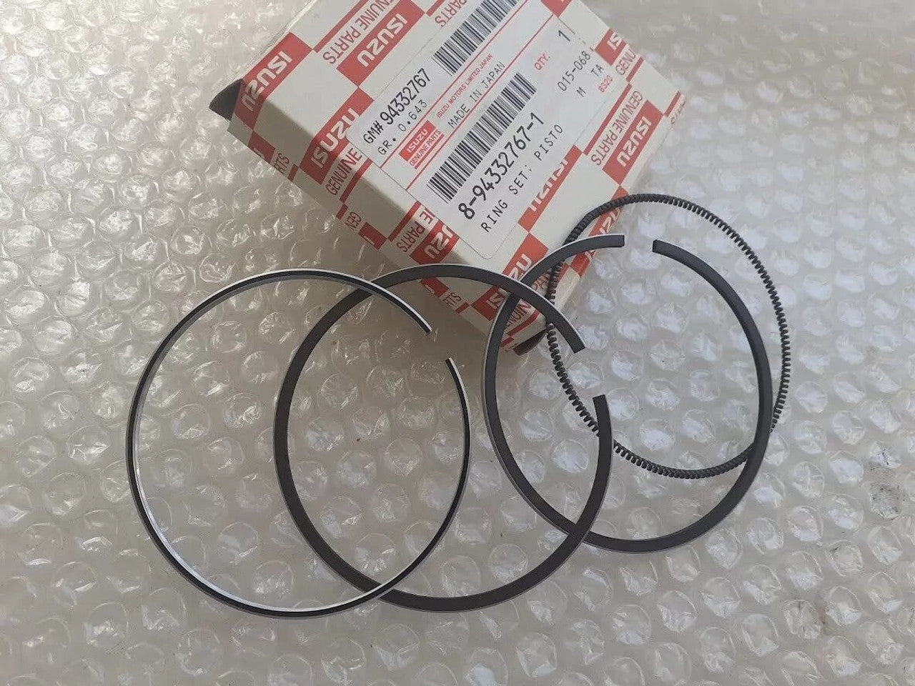 4x Piston Rings Set fits Isuzu 4EC1 Opel Vauxhall 15D 15TD STD 76mm Genuine 8943327671 View Front