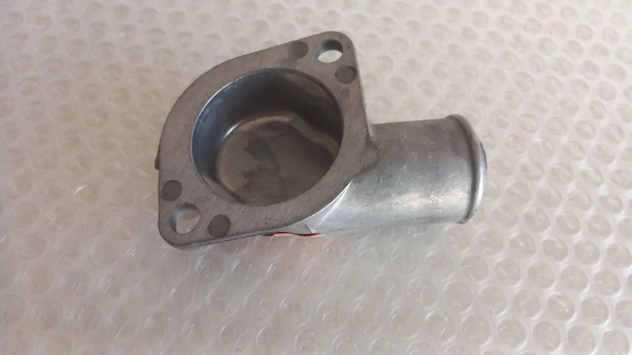 Water Elbow Outlet Thermostat Cover fits Mitsubishi Colt 1100 11 MD010550 View Close Up Front