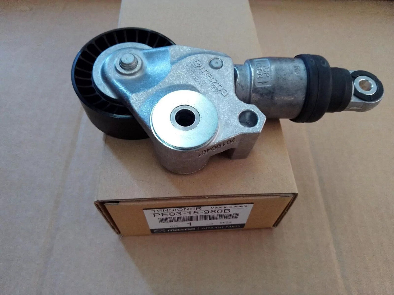 Outer Belt Tensioner fits Mazda PE03-15-980B Genuine View Front